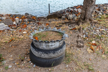 Saint Vincent and the Grenadines, Admiralty Bay, Bequia, tire flower  pot