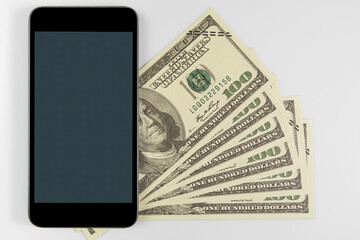 Smartphone on US banknotes of one hundred dollars