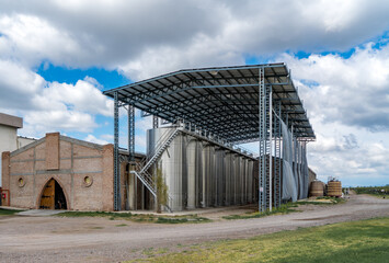 Fototapeta na wymiar Stainless steel wine silos in Argentina in the Argentinean region of Mendoza