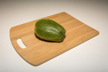 chayote on a bamboo  cutting board