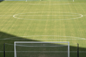 Green football field with nobody