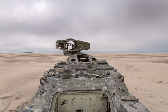 Army Tank With Bullet Holes On The Beach