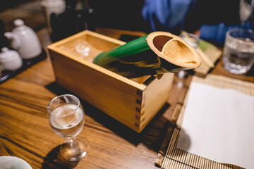 Fototapeta na wymiar Traditional bamboo bottle with sake in ice at restaurant, Japan
