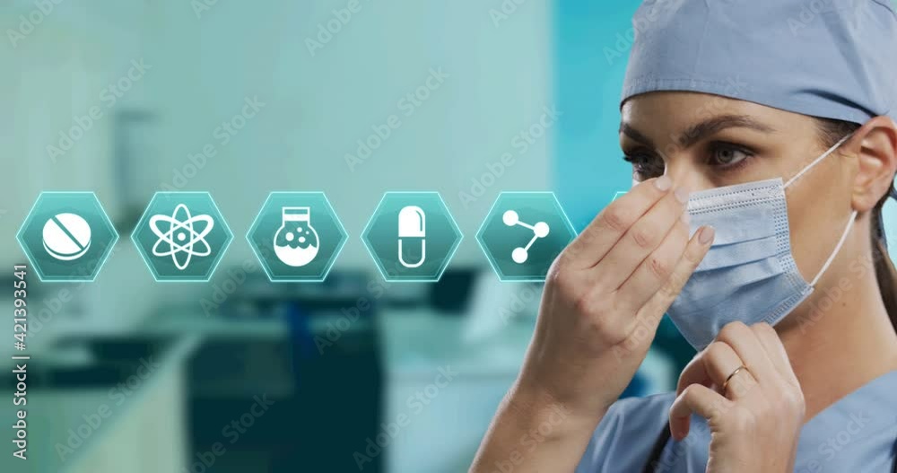 Sticker Animation of hexagon medical icons over female doctor wearing face mask