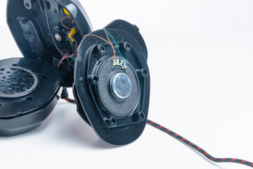 Repair of broken headphones with a microphone. Close-up.