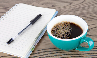 A cup of coffee and a book