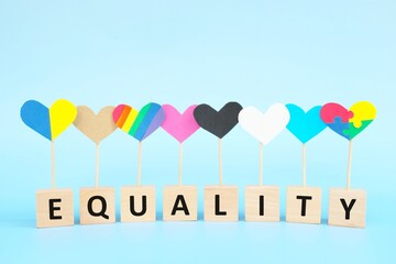 Cultural, racial, gender, age and general equality, inclusion, love and diversity concept. Multicolored heart shape icons in blue background.