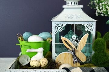 Easter farmhouse vignette with bunnies, Easter eggs and buffalo plaid check.