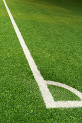 Fototapeta premium green artificial grass football field with white line sport background