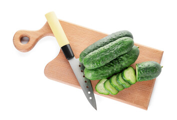 Cutting board with cucumber and knife on white background