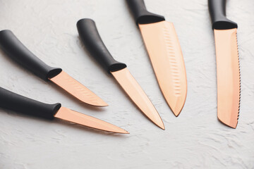 Set of knives on light background
