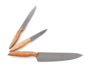 Set of knives with wooden handle on white background