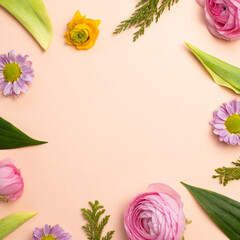 Obraz na płótnie Canvas Spring flowers on pink background. flat lay, top view, copy space