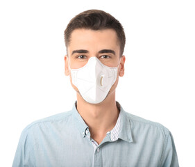 Young man wearing medical mask on white background
