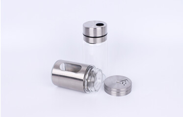 Stainless steel seasoning container on white background