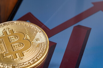 Bitcoin and chart, close up