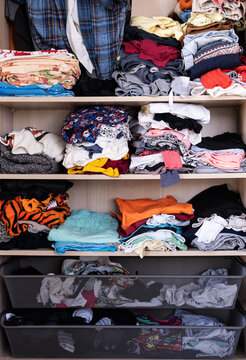 Full Frame Shot Of Messy Wardrobe