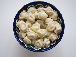 Dumplings in the national dish. Russian and Asian traditional cuisine. Studio photography