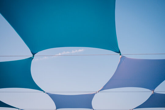 Full Frame Shot Of Multi Colored Umbrella Against Blue Sky