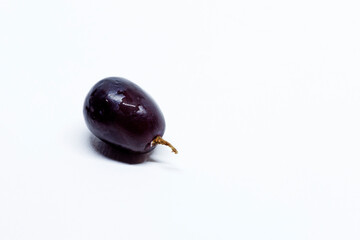 a red grape on a white background