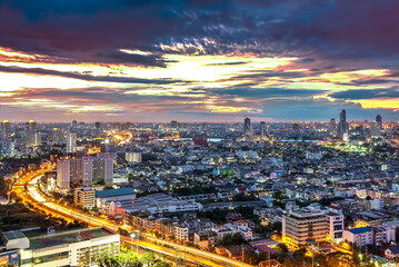 Bangkok Transportation at Dusk with Modern Business Building along the river (Thailand)