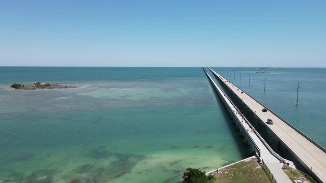 Drone flight north from Duck Key to the bridge near Little Money Key.  Little Money Key is visible on the left side over the beautiful green ocean along US highway 1