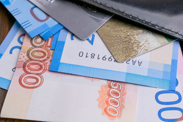 money and bank cards sticking out of the wallet