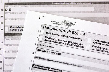 German tax form Hauptvordruck ESt 1 A with pen and euro bills