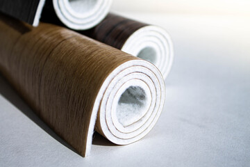 Linoleum. Three rolls of linoleum on a white background.
