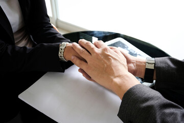 Holding hands with business partners to trust business partners, relationships to achieve future commercial and investment goals.