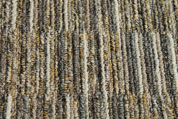 Texture of carpet floor close-up. Brown carpet with a pattern.