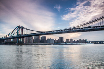 Fototapeta na wymiar The Manhattan Bridge in NYC providing crossing across the Hudson River.