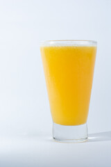 glass of orange juice, with natural orange on white background