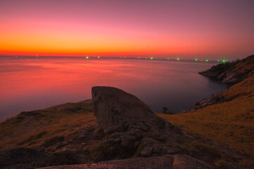 The natural background of the morning light rising in the middle of the sea and surrounded by mountains, cool breezes, the beauty of the ecology of the tourist attractions.