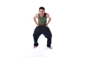 Funny young guy in big pants. Diet and weight loss. The result of fitness and training. White background. Isolate.