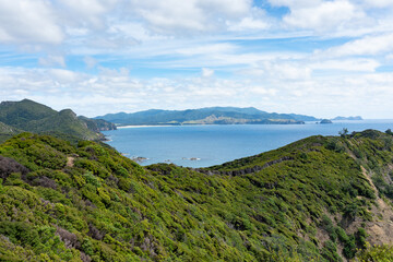 Fototapeta na wymiar View over bushclad hills of Great Barrier Island to bays and sea