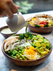Cafe - Salad bowl with variety of vegetable, beans, salad cream