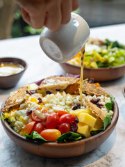 Cafe - Salad bowl with variety of vegetable, beans, salad cream