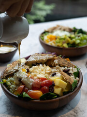 Cafe - Salad bowl with variety of vegetable, beans, salad cream