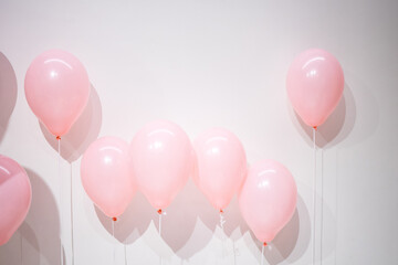 pink balloons with ribbon