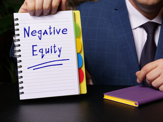 Financial concept about Negative Equity with phrase on blank notepad.