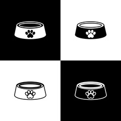 Set Pet food bowl for cat or dog icon isolated on black and white background. Dog or cat paw print. Vector