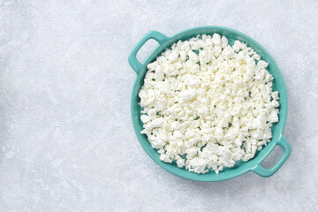 Cottage cheese with berries and mint. Cottage cheese in a bowl. Top view. Dairy products.