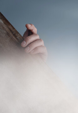 Close-up Of Human Hand  On Wood Board In Fog