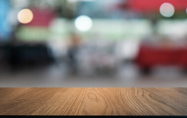 Empty wooden table in front of abstract blurred background of coffee shop . can be used for display or montage your products.Mock up for display of product