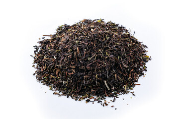 Heap of black tea on a white background. Dry black tea leaves isolated on white background, delicious, natural. Flat lay.