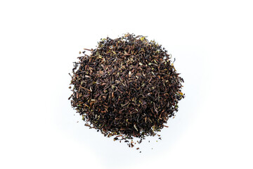 Heap of black tea on a white background. Dry black tea leaves isolated on white background, delicious, natural. Flat lay.