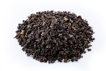 Heap of black tea on a white background. Dry black tea leaves isolated on white background, delicious, natural. Flat lay.