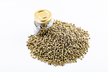Dry bunch of green peppercorns, peppercorns isolated on white. Spice jar.Green peppercorns. Heap of tea on a white background. Close up. A high resolution.