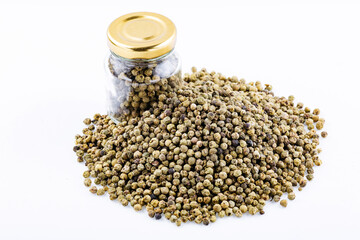 Dry bunch of green peppercorns, peppercorns isolated on white. Spice jar.Green peppercorns. Heap of tea on a white background. Close up. A high resolution.